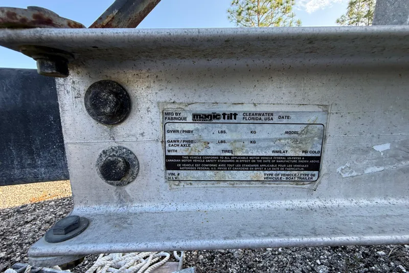 Slide: The Image of Label on a Magic Tilt boat trailer, Clearwater, Florida, USA, near bolts and ropes. - 38