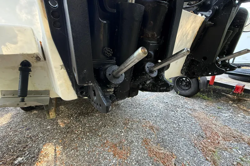 Slide: The Image of Close-up of a 2000 Sport-Craft 241 Walk Around boat's outboard motor components. - 40