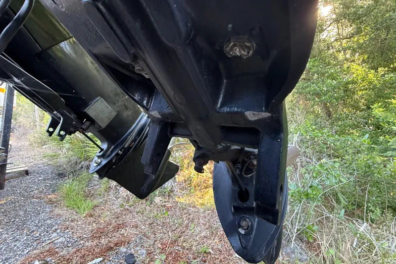 Slide: The Image of Close-up of a 2000 Sport-Craft 241 Walk Around boat's underside, showing mechanical details. - 41