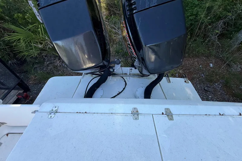 Slide: The Image of 2000 Sport-Craft 241 Walk Around boat with dual outboard motors, viewed from above. - 52