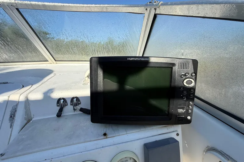 Slide: The Image of Humminbird fish finder on 2000 Sport-Craft 241 Walk Around boat dashboard. - 59