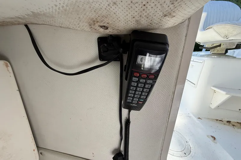 Slide: The Image of VHF radio mounted on a 2000 Sport-Craft 241 Walk Around boat interior. - 73