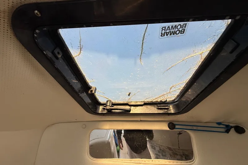 Slide: The Image of Interior view of a 2000 Sport-Craft 241 Walk Around boat's hatch window. - 76