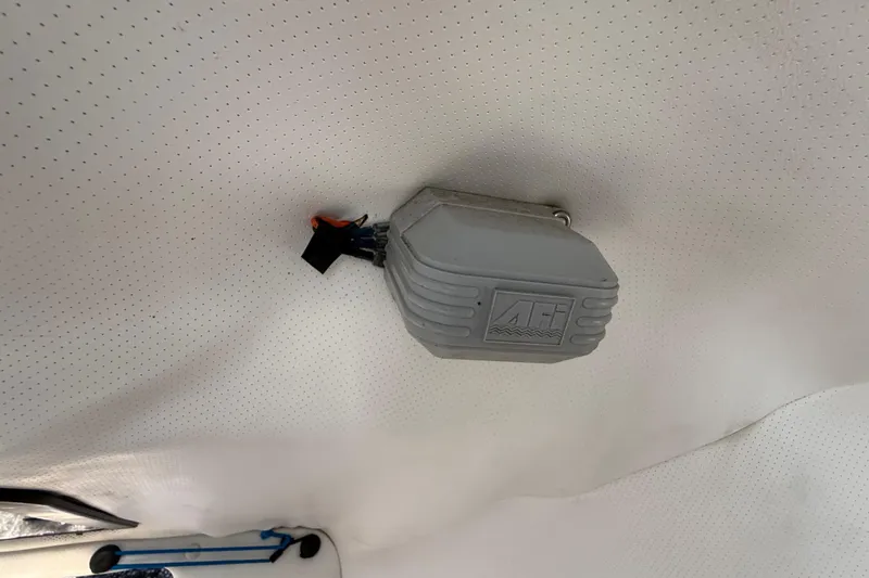 Slide: The Image of Ceiling-mounted device inside 2000 Sport-Craft 241 Walk Around boat cabin. - 78