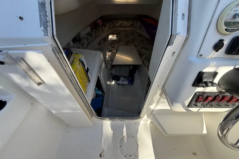 Slide: The Image of Interior cabin view of a 2000 Sport-Craft 241 Walk Around boat. - 79