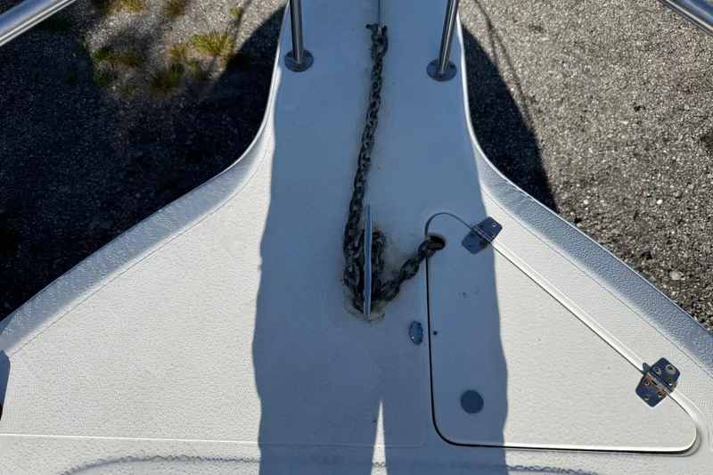 Slide: The Image of Bow of 2000 Sport-Craft 241 Walk Around boat with anchor chain and cleat. - 81