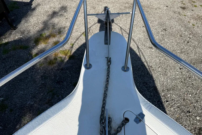 Slide: The Image of Bow of 2000 Sport-Craft 241 Walk Around with anchor chain and railing. - 82