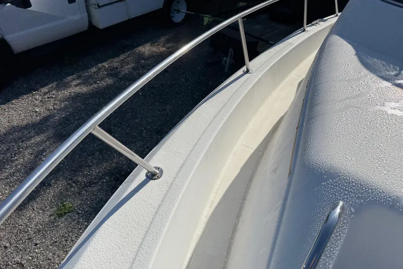 Slide: The Image of 2000 Sport-Craft 241 Walk Around boat deck with stainless steel railing. - 91