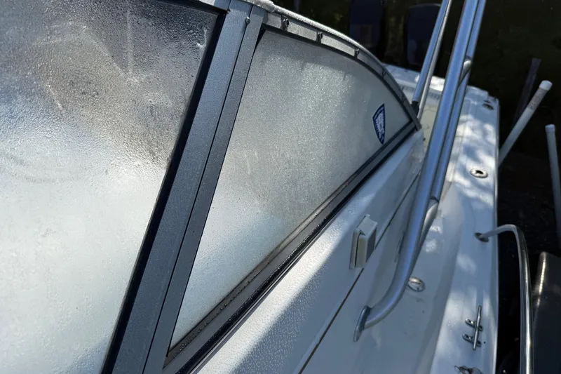 Slide: The Image of Close-up of 2000 Sport-Craft 241 Walk Around boat window with morning dew. - 95