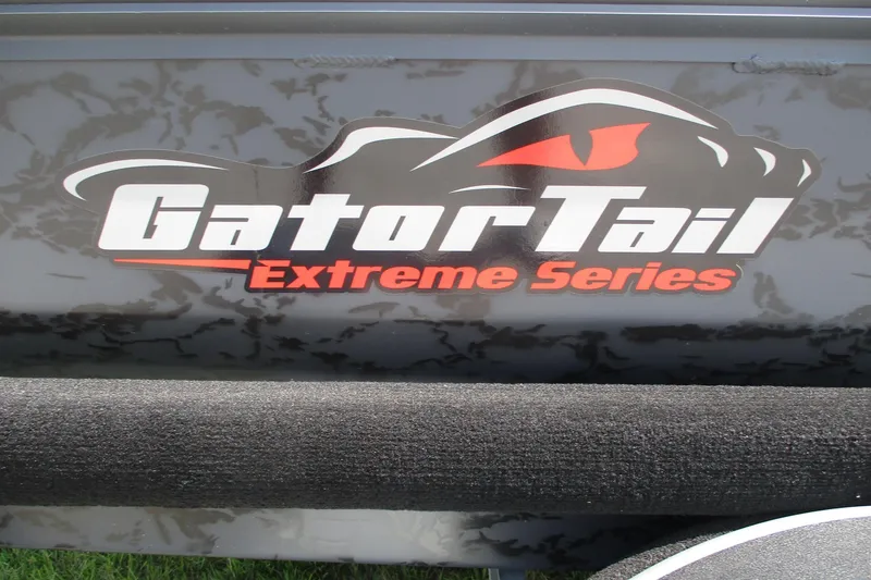 Slide: The Image of Gator Tail 1854 Extreme Series logo on a textured surface, 2026 model. - 11