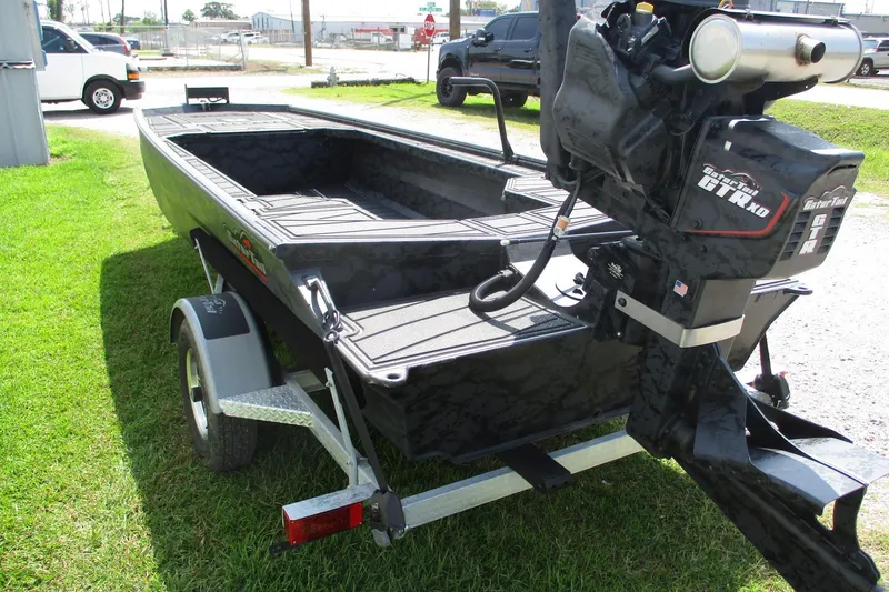 Slide: The Image of 2026 Gator Tail 1854 Extreme boat on trailer, parked on grass. - 7