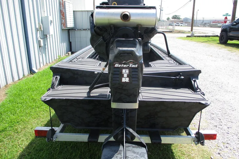 Slide: The Image of 2026 Gator Tail 1854 Extreme boat with GTR motor, parked outdoors. - 8