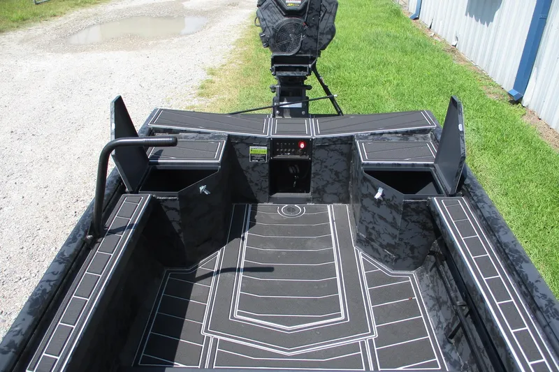 Slide: The Image of 2026 Gator Tail 1854 Extreme boat interior with storage compartments and sleek design. - 9