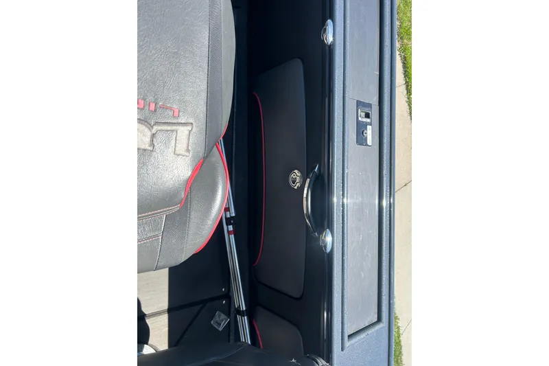 Slide: The Image of Interior view of a 2021 Lund 2075 Pro-V Limited boat, featuring seating and storage. - 14