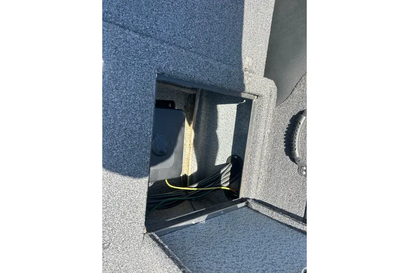 Slide: The Image of Open storage compartment in 2021 Lund 2075 Pro-V Limited boat, showing interior wiring. - 15