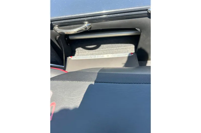 Slide: The Image of Interior view of 2021 Lund 2075 Pro-V Limited boat, featuring storage compartment. - 16