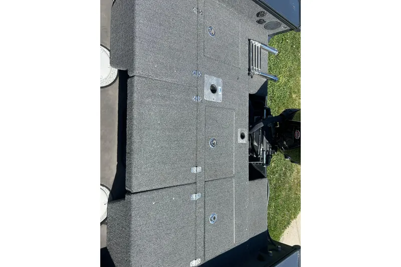 Slide: The Image of 2021 Lund 2075 Pro-V Limited boat deck with storage compartments and motor. - 18