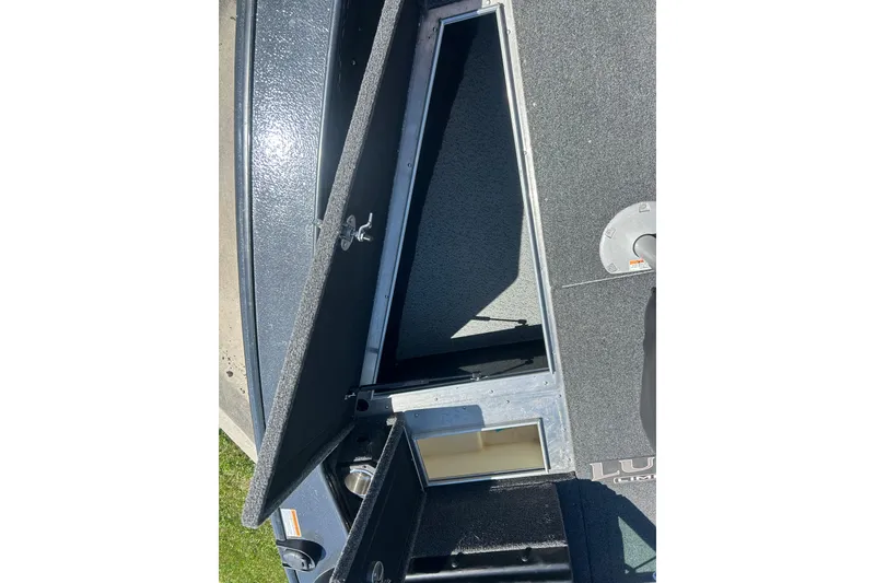 Slide: The Image of Open storage compartments on a 2021 Lund 2075 Pro-V Limited boat deck. - 25
