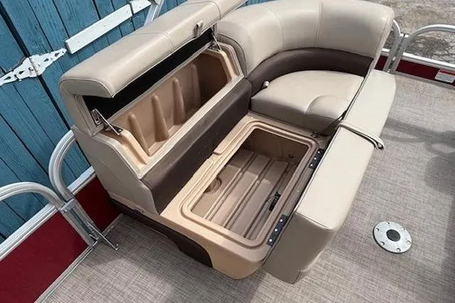 Slide: The Image of 2019 Sun Tracker SportFish 22 DLX boat seating with open storage compartments. - 11