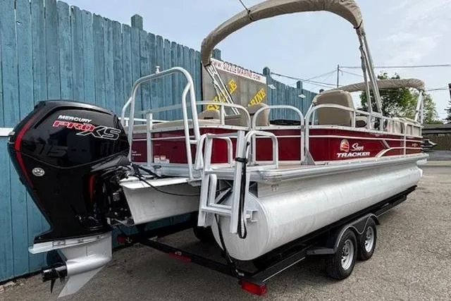 Slide: The Image of 2019 Sun Tracker SportFish 22 DLX pontoon boat with Mercury Pro XS engine on trailer. - 5