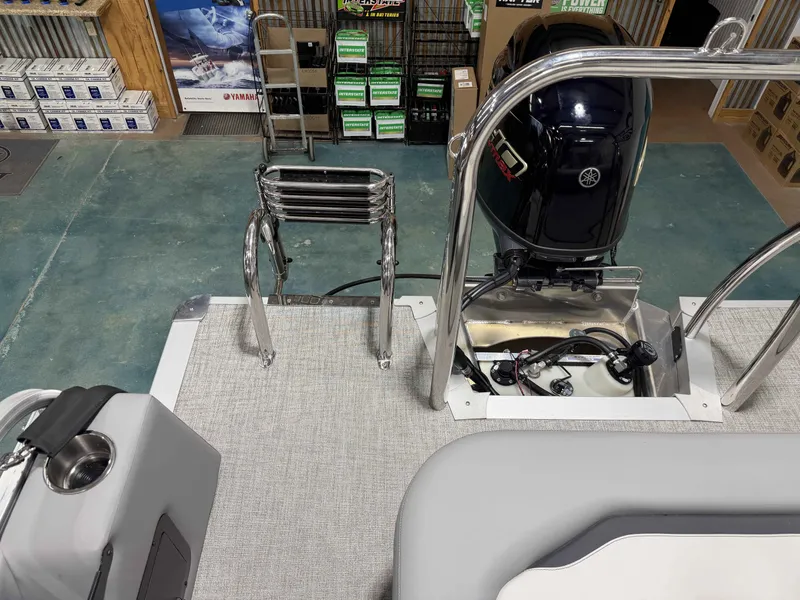 Slide: The Image of Avalon VNT VRB21 2026 boat with motor and ladder in workshop. - 12