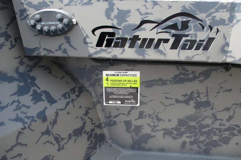 Slide: The Image of 2026 Gator Tail 1754 Extreme boat with camouflage design and capacity label. - 10