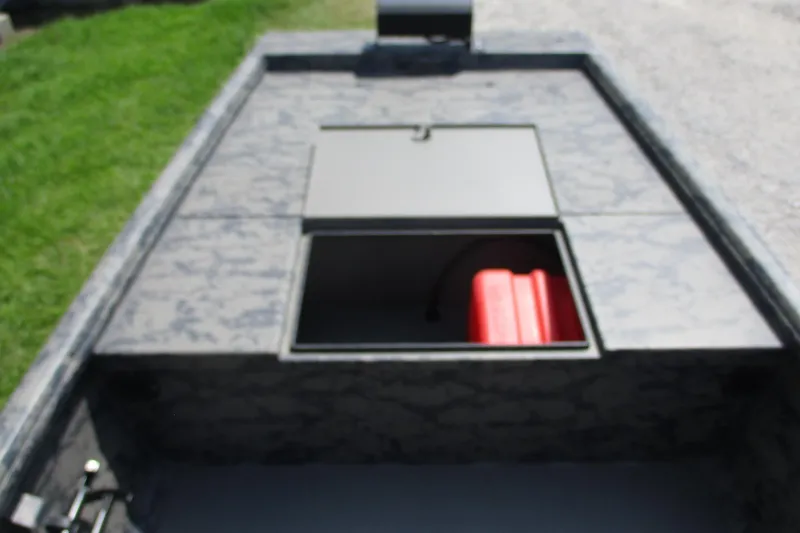 Slide: The Image of 2026 Gator Tail 1754 Extreme boat with open storage compartment and red fuel tank. - 3