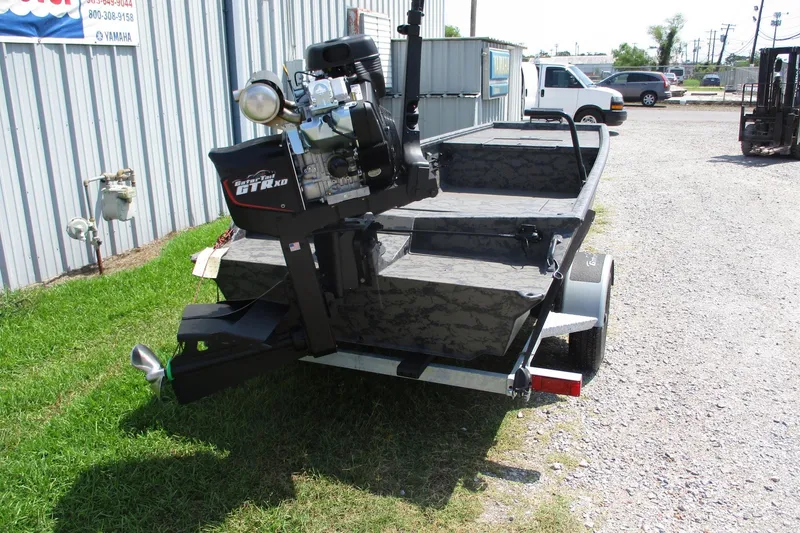 Slide: The Image of 2026 Gator Tail 1754 Extreme boat with powerful motor, parked outdoors on grass. - 5