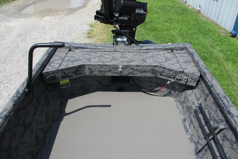 Slide: The Image of 2026 Gator Tail 1754 Extreme boat interior with camouflage design and motor. - 7