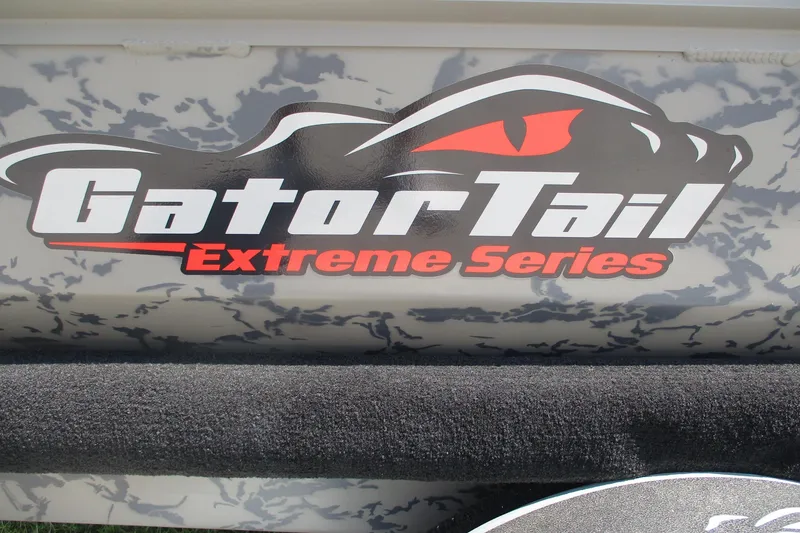 Slide: The Image of Gator Tail 1754 Extreme Series logo on camouflage background, 2026 model. - 9