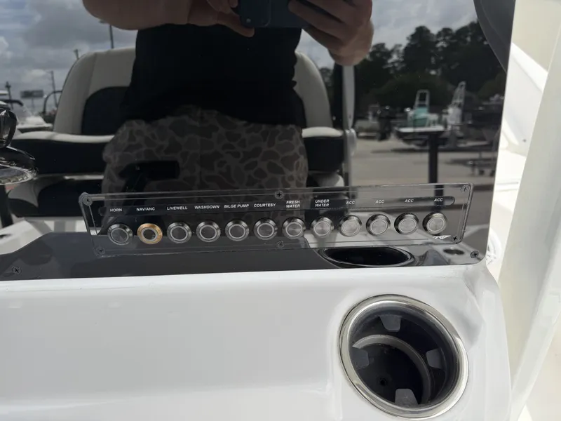 Slide: The Image of Control panel of Tidewater 2210 Carolina Bay 2026 with switches and holder. - 10