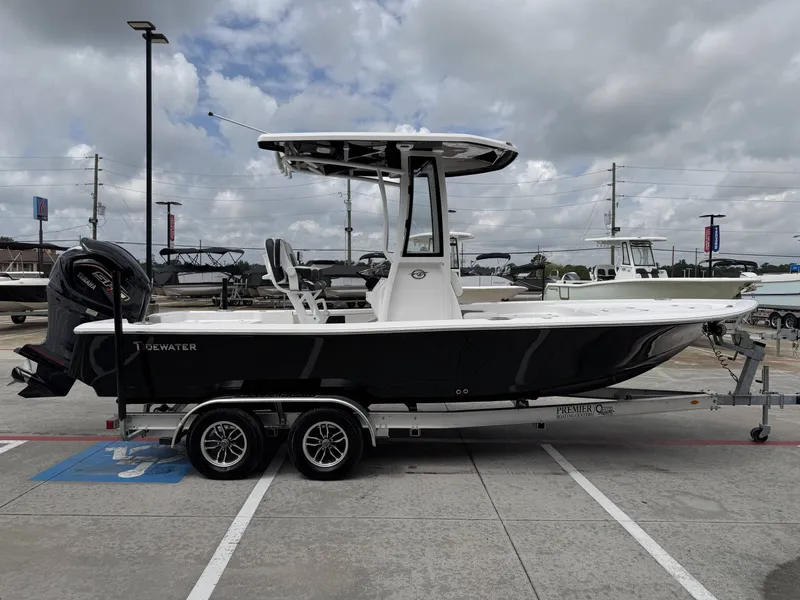 Slide: The Image of 2026 Tidewater 2210 Carolina Bay boat on trailer outdoors. - 6
