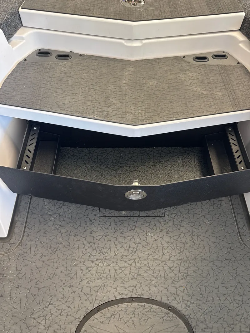 Slide: The Image of Vexus VXs21 2025 boat with open storage compartment. - 32