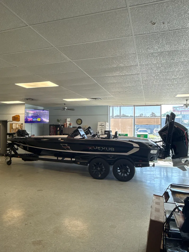 Slide: The Image of 2025 Vexus VXs21 boat displayed in showroom. - 46