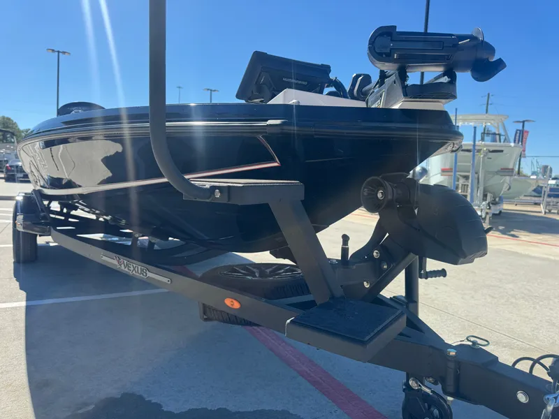 Slide: The Image of 2025 Vexus VXs21 boat on trailer outdoors. - 48