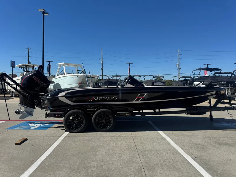 Slide: The Image of 2025 Vexus VXs21 boat displayed outdoors on a trailer. - 49