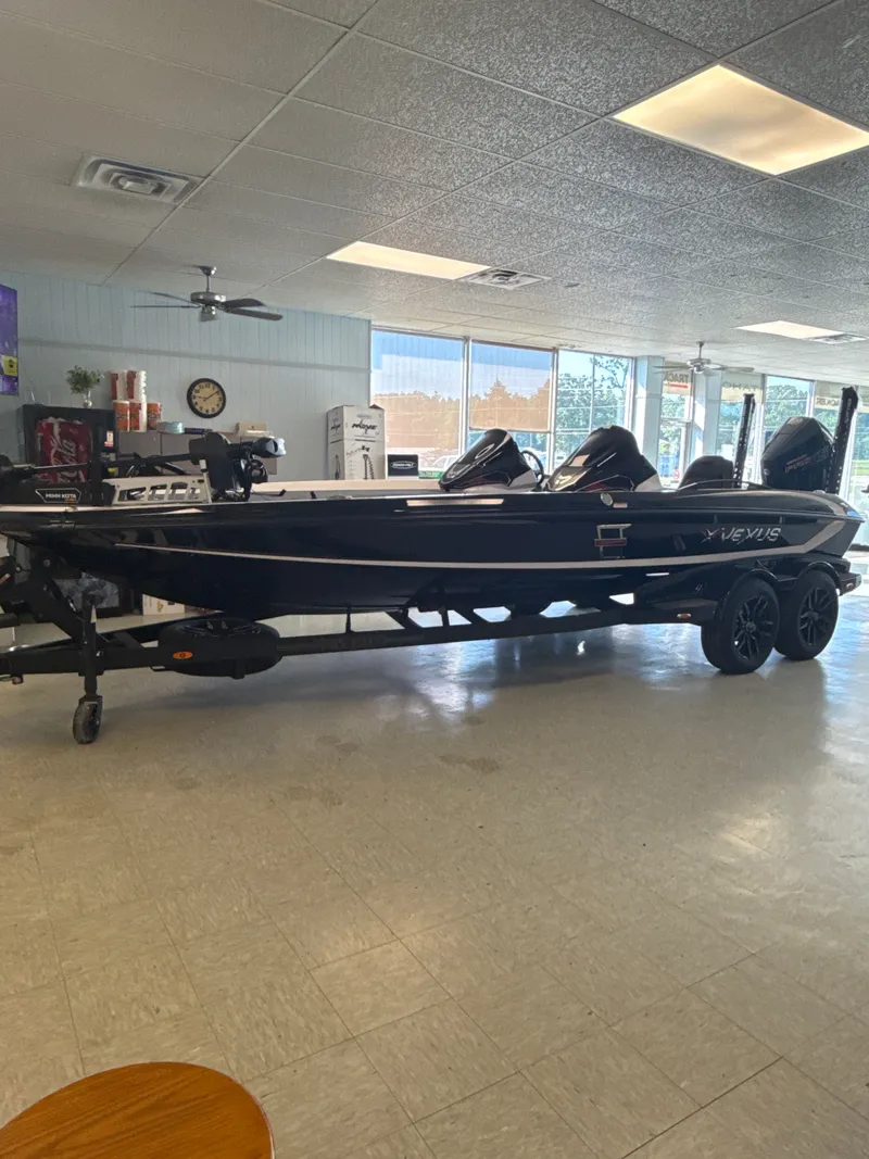 Slide: The Image of 2025 Vexus VXs21 boat displayed in a showroom. - 6