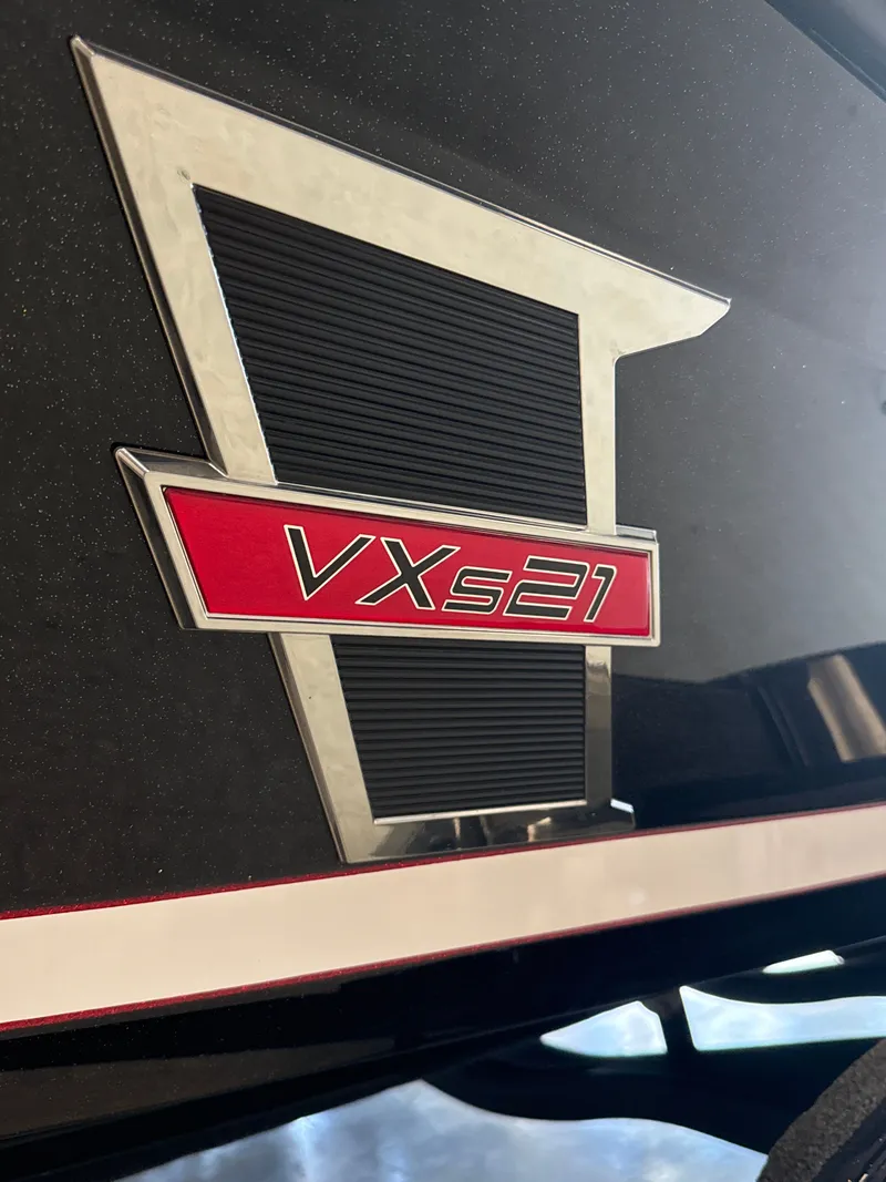 Slide: The Image of Vexus VXs21 2025 logo on black background. - 8