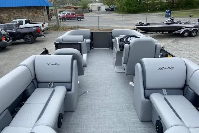 Slide: The Image of 2025 Bentley Pontoons Legacy 220 Navigator with luxurious seating and modern design. - 4
