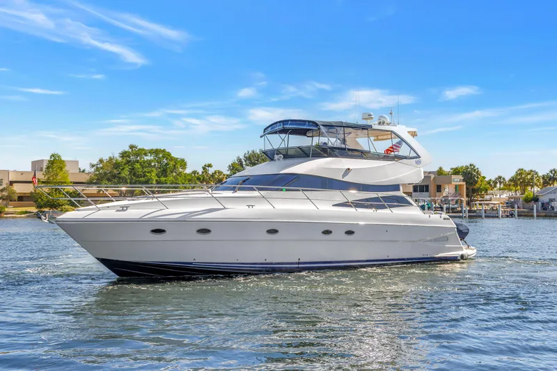 Slide: The Image of 2001 Neptunus 56 Flybridge yacht cruising on a sunny day. - 21