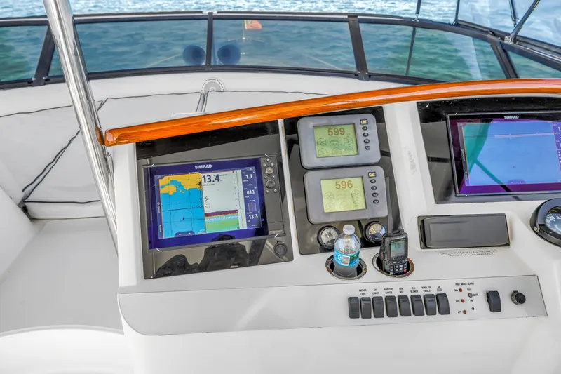 Slide: The Image of Control panel of a 2001 Neptunus 56 Flybridge yacht with navigation displays. - 26
