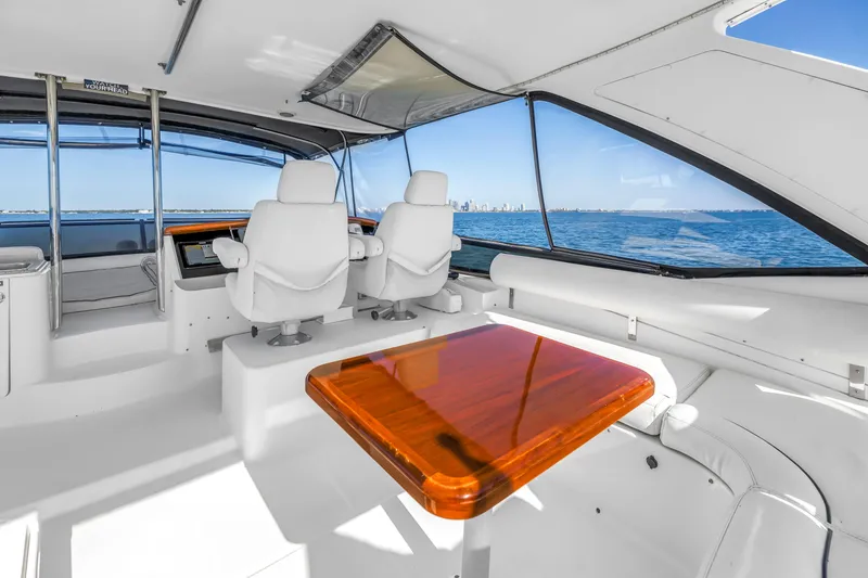 Slide: The Image of Flybridge interior of 2001 Neptunus 56 yacht with ocean view and seating area. - 27