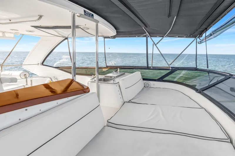 Slide: The Image of Luxurious 2001 Neptunus 56 Flybridge yacht interior with ocean view and comfortable seating. - 33