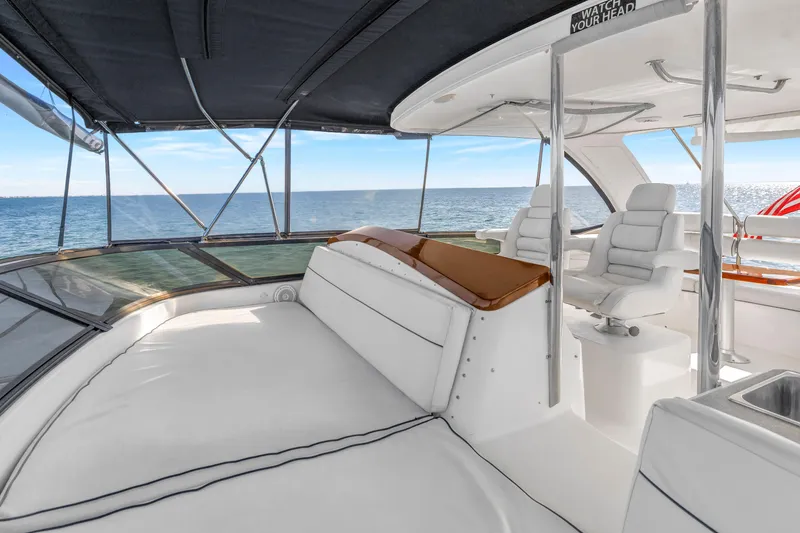 Slide: The Image of Luxurious 2001 Neptunus 56 Flybridge yacht interior with ocean view and plush seating. - 35