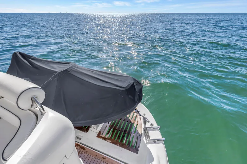 Slide: The Image of 2001 Neptunus 56 Flybridge yacht on sparkling ocean waters. - 39