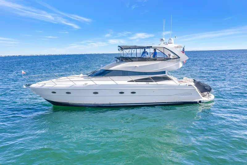 Slide: The Image of 2001 Neptunus 56 Flybridge yacht cruising on open blue waters. - 5