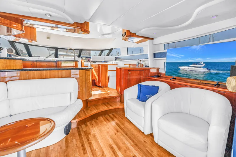 Slide: The Image of Luxurious interior of 2001 Neptunus 56 Flybridge yacht with elegant wood and leather furnishings. - 53