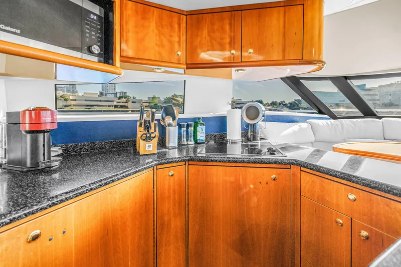 Slide: The Image of Luxurious kitchen interior of 2001 Neptunus 56 Flybridge yacht with modern appliances. - 60