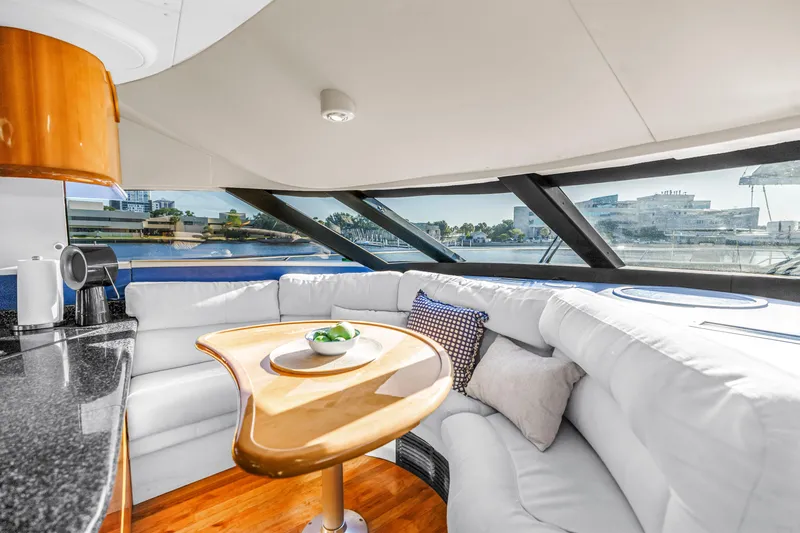 Slide: The Image of Luxurious Neptunus 56 Flybridge 2001 yacht interior with elegant seating and panoramic windows. - 67