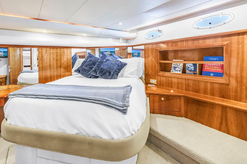 Slide: The Image of Luxurious cabin interior of 2001 Neptunus 56 Flybridge yacht with elegant wood finish. - 69